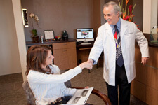 Top Sedation Dentist Dr. Briscoe shaking hands with a patient at La Jolla Dental