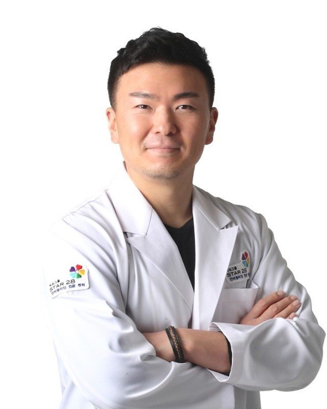 Dr. Michael Han in white coat