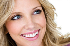 Beautiful blonde woman smiling with white teeth